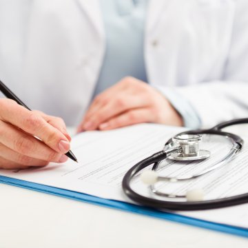 doctor completing chart credit repair